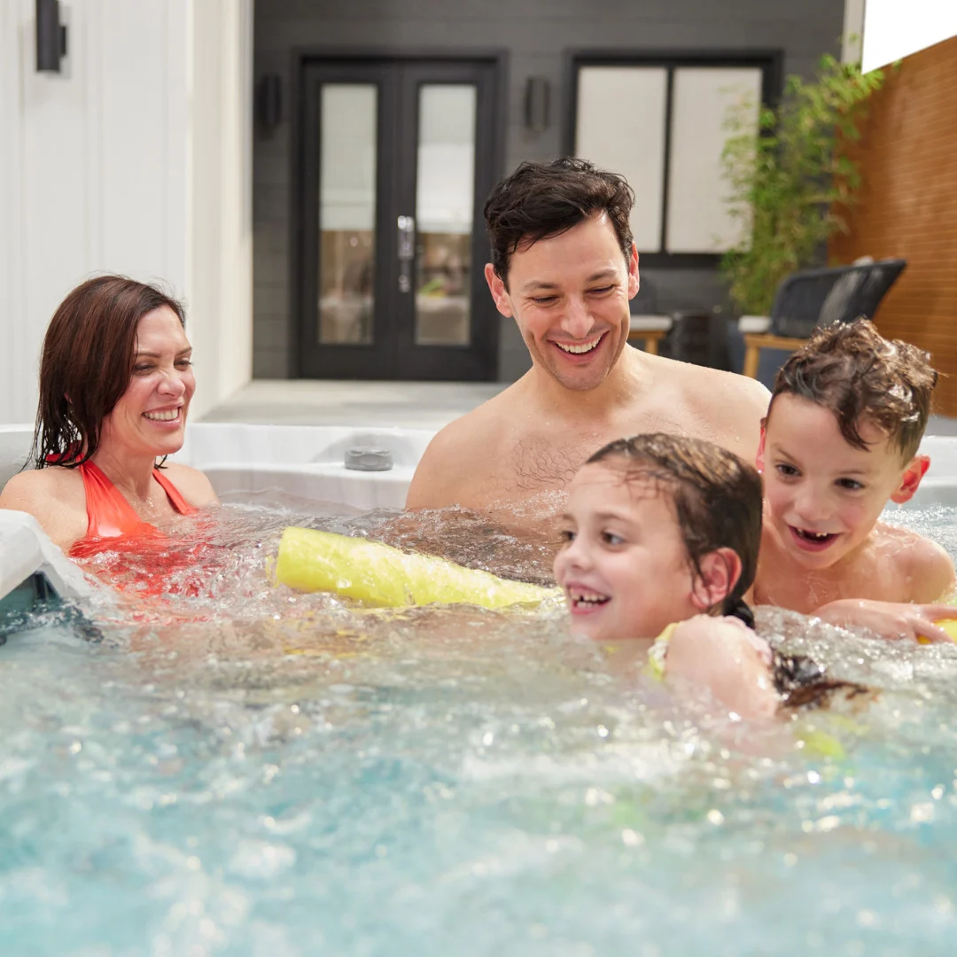 Family enjoying a bubbling hot tub together from High Elevation Hot Tubs